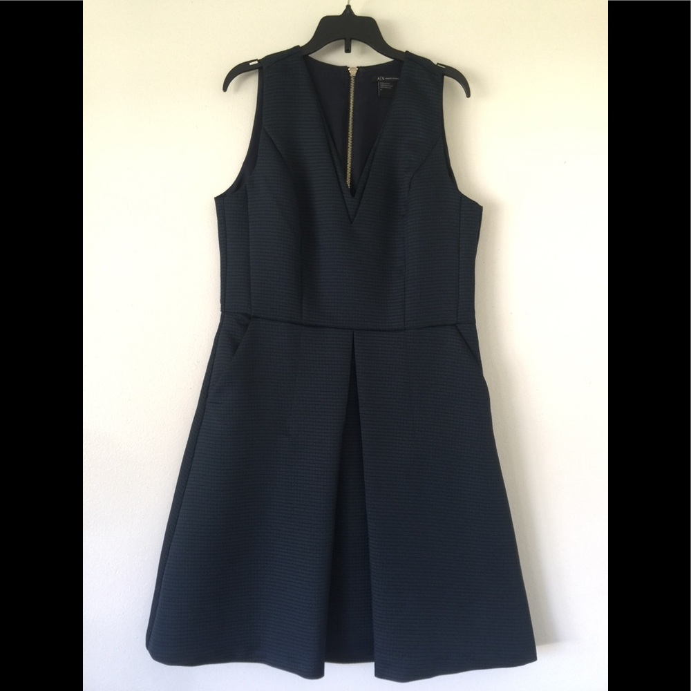 Armani dress with side pockets.